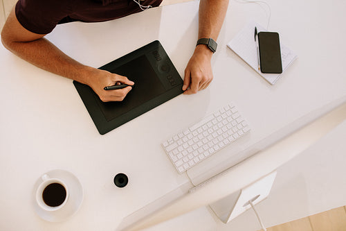 Top view of a computer and digitizer on table