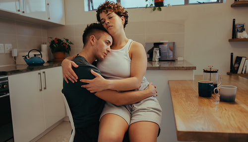 Young woman bonding with her boyfriend at home