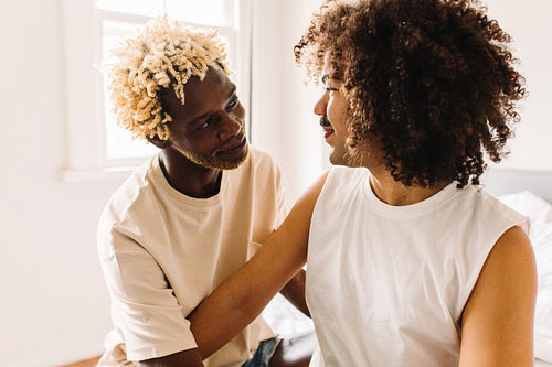 Two male lovers sharing eye contact
