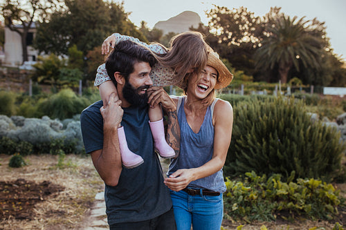 Beautiful family of three having fun at their farm