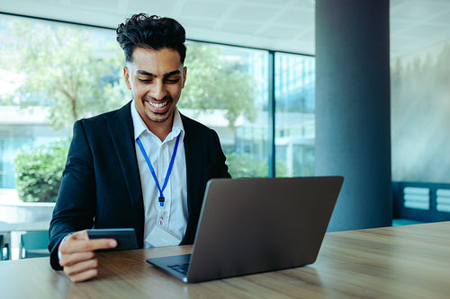 Business professional enjoying convenient online shopping in modern office