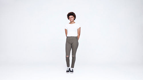 Curly haired woman looking at camera