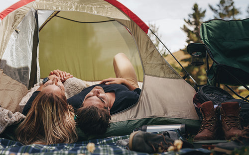 Camping couple sleeping in a tent