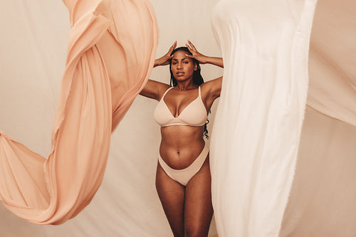 Curvy young woman posing in underwear