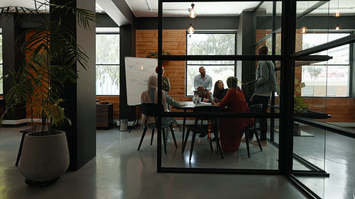 Collaboration in a coworking office: Creative business team having a discussion on a project