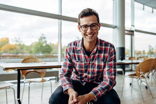 Young business professional smiling at camera