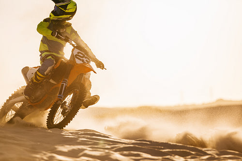 Off road biker on sand dunes