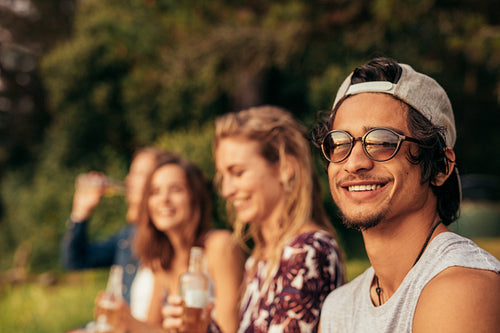 Young friends hanging out at the lake