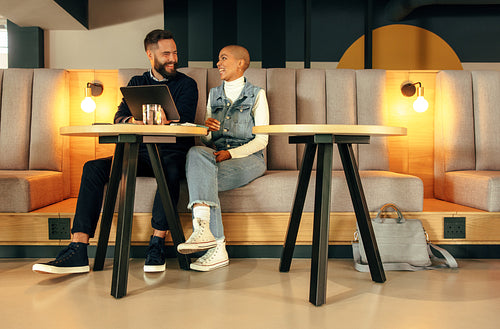 Modern businesspeople working together in an office lobby