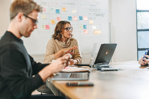 Business professionals collaborating in a productive office meeting