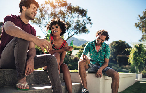 Young friends having a party in backyard garden