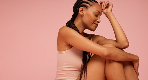 African american woman sitting with eyes closed