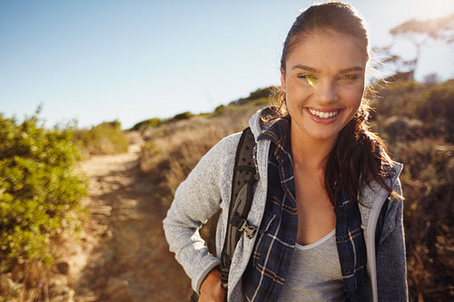 Young female tourist hiking in nature