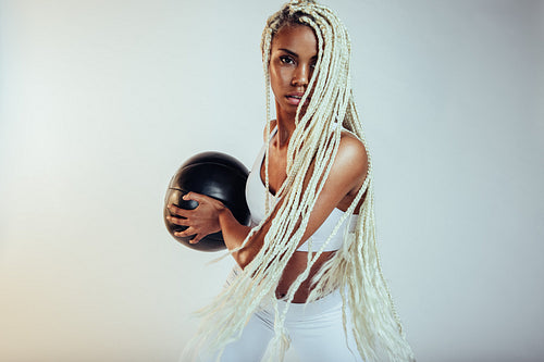 Monochrome portrait of female athlete working out