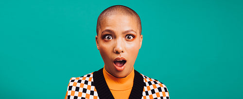 Woman looking shocked in a studio