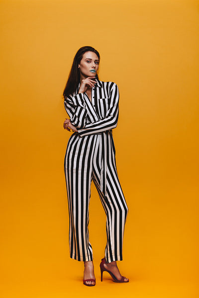 Attractive woman in striped jumpsuit