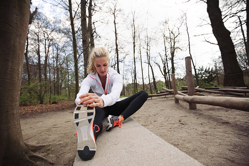 Woman stretching her muscles before a run