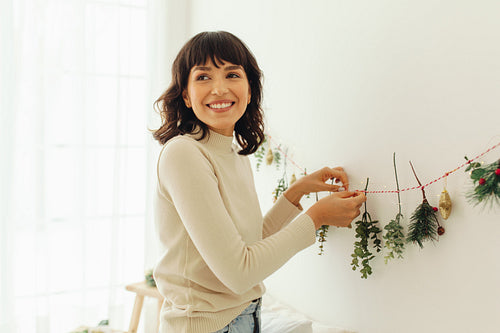 Woman decorating home for christmas