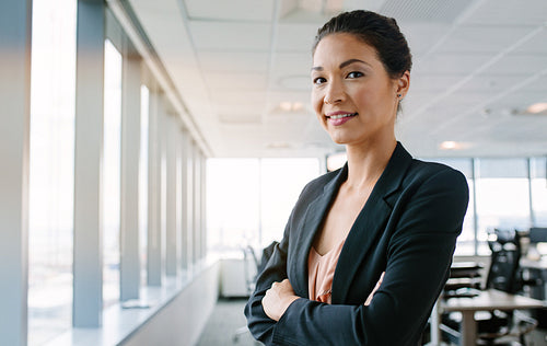 Female executive looking at camera confidently