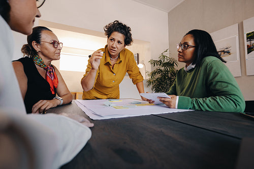 Team discussing project management strategies in a modern meeting room