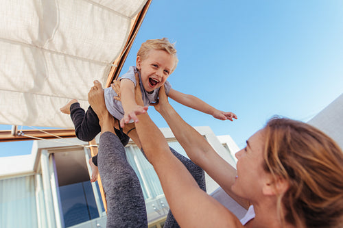 Mother and some playing together at home