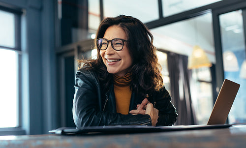 Smiling asian businesswoman at office