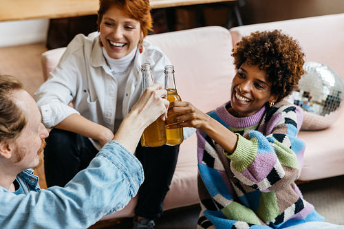 Colleagues celebrating with drinks in a co-working space