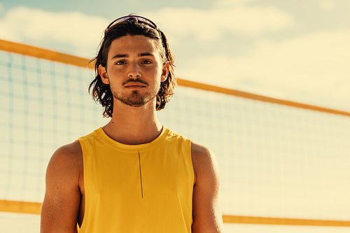 Australian championship beach volleyball player on coastal beach