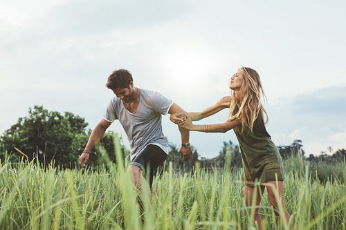 Happy young couple enjoying a day in nature