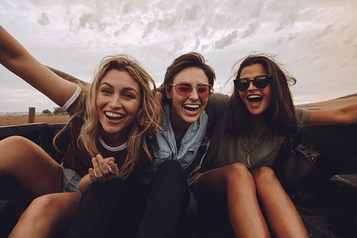 Friends having a great time on country road trip