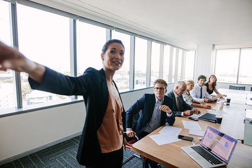 Multi-ethnic business group at presentation.