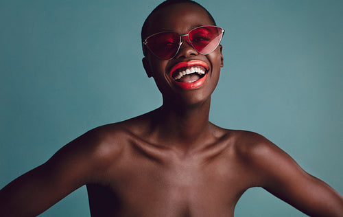 Cheerful black female model with buzz cut hairstyle