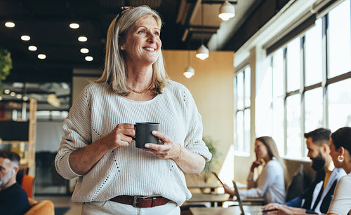 Mature businesswoman looking away thoughtfully
