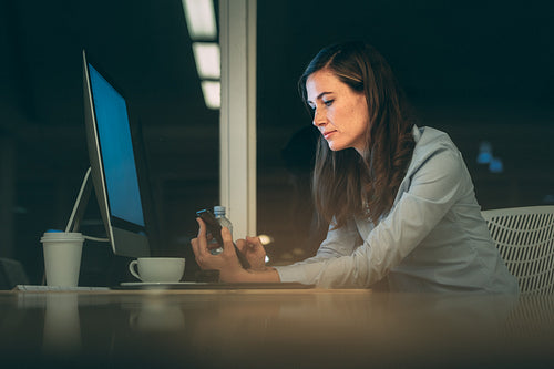 Businesswoman working late night in office