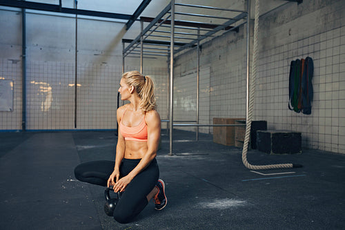 Fit female athlete at crossfit gym