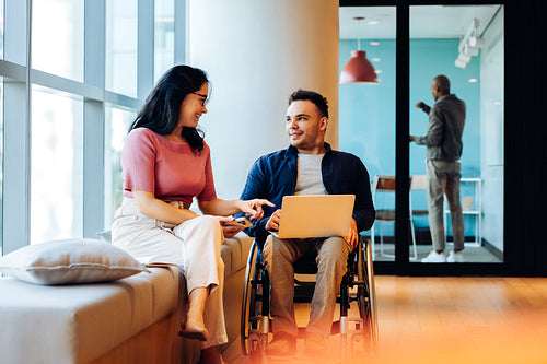 People collaborating in a modern office lounge today