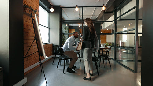 Professionals from different backgrounds sharing a workspace in a coworking office
