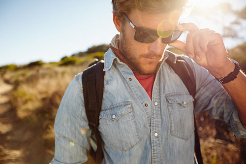 Young man on country hike