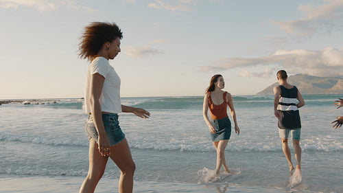 Group of friends enjoying summertime on the beach