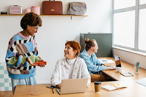 Colleagues collaborating in a bright freelance co-working space