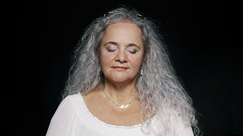 Senior woman with eyes closed