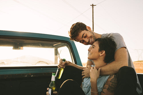 Couple enjoying on a road trip in their pick up truck