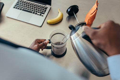Man preparing coffee at home