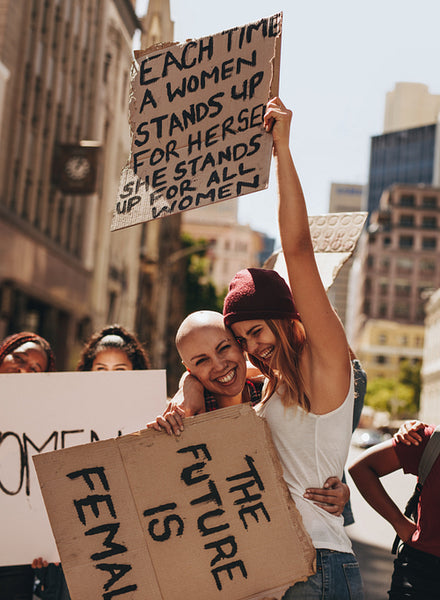 Happy young activists protesting with signboards