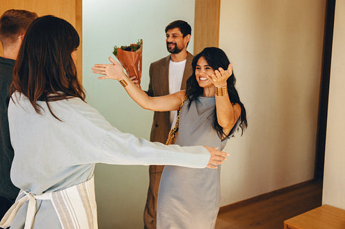 Warm welcome as friends arrive for a dinner at someone's home