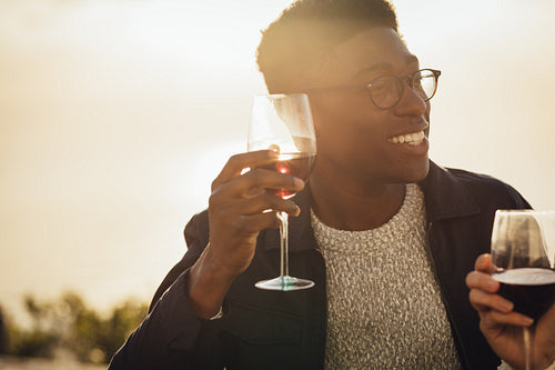 Couple enjoying with wine on picnic