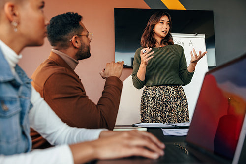 Female manager giving a presentation in a boardroom
