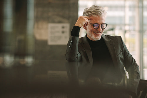 Man in formal wear relaxing at cafe