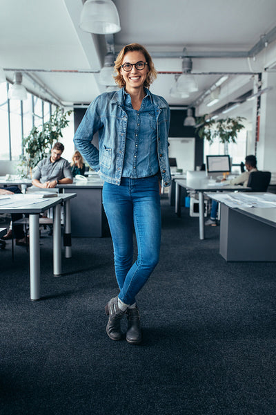Young female manager standing in office