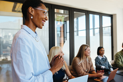 Diverse team members engaging in a collaborative business discussion during a meeting